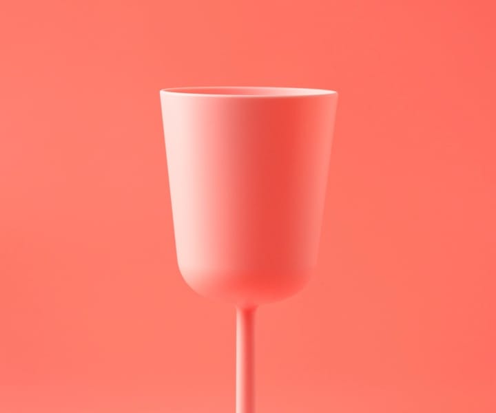 glass with pink background